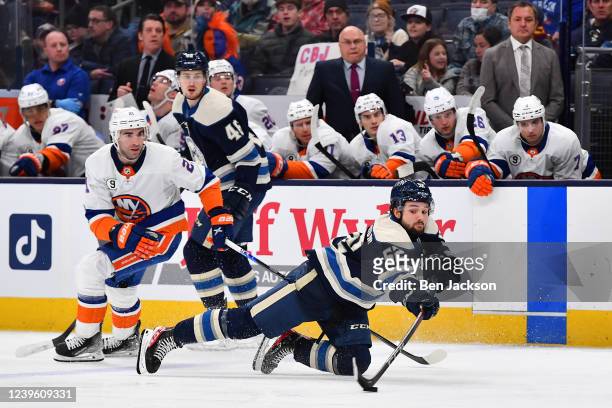 Emil Bemstrom of the Columbus Blue Jackets reaches for the puck against Kyle Palmieri of the New York Islanders during the third period at Nationwide...
