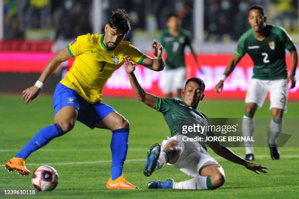Brazil's Lucas Paqueta and Bolivia's Roberto Fernandez vie for the ball during their South American qualification football match for the FIFA World...
