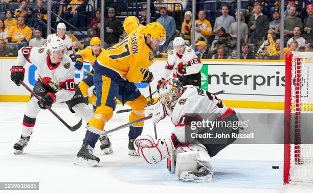 Michael McCarron of the Nashville Predators scores a goal against Anton Forsberg of the Ottawa Senators during an NHL game at Bridgestone Arena on...