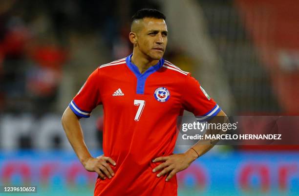 Chile's Alexis Sanchez reacts after losing against Uruguay the South American qualification football match between Chile and Uruguay, failing to...