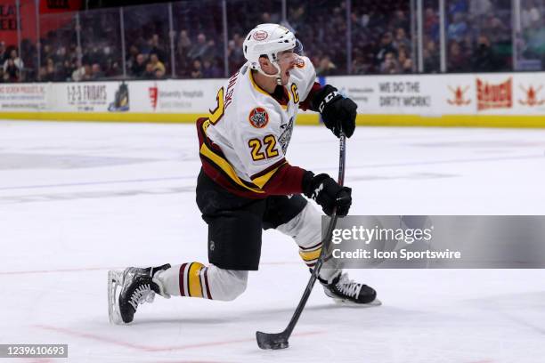 Chicago Wolves center Andrew Poturalski shoots the puck during the first period of the American Hockey League game between the Chicago Wolves and...