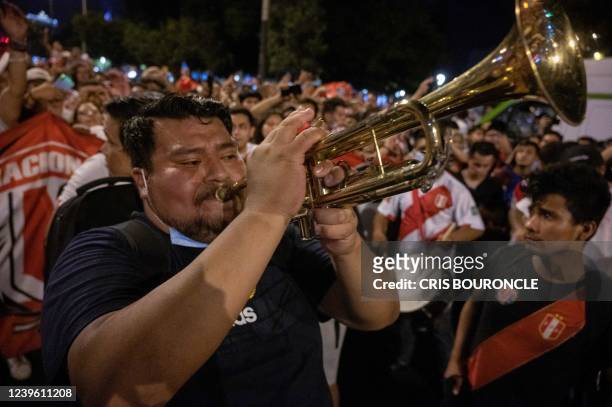 Thousands of football fans celebrate in the streets after Peru defeated Paraguay in their South American qualification football match for the FIFA...