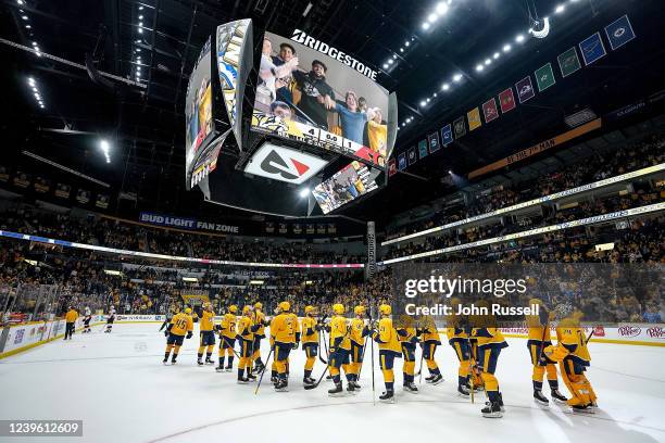 The Nashville Predators celebrate a 4-1 win against the Ottawa Senators during an NHL game at Bridgestone Arena on March 29, 2022 in Nashville,...