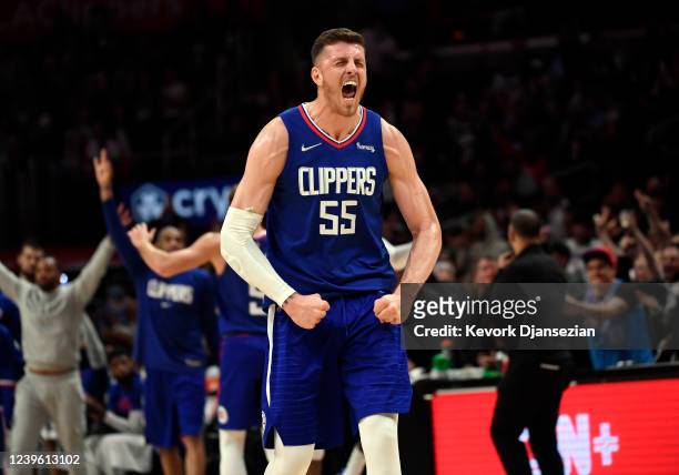 Isaiah Hartenstein of the Los Angeles Clippers celebrates after assisting on three-point basket by Robert Covington against the Utah Jazz during the...