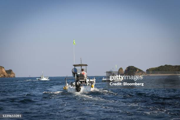 Fishing boats leave Katsumoto port in Iki, Nagasaki Prefecture, Japan, on Wednesday, Oct. 27, 2021. Iki was the first city district in Japan to...