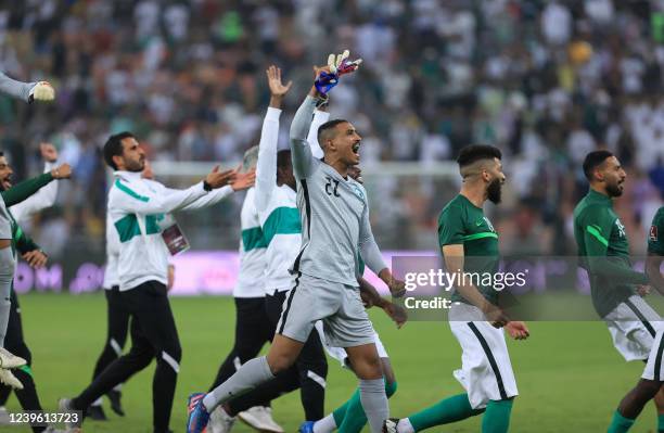 Saudi Arabia's team celebrate after beating Australia 1-0 in their 2022 Qatar World Cup Asian Qualifying match at the King Abdullah Sport City...