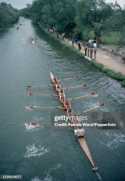 An aerial view of a coxed eight rowing competition on the River Cam during May Eights Week at Cambridge University, circa May 1978.