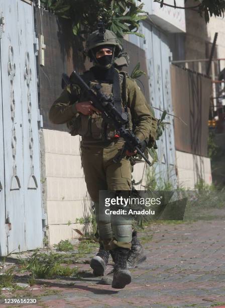 Israeli army forces raid the home of the Palestinian, who fatally shot five Israelis in the city of Bnei Brak, near Tel Aviv, in Ya'bad town of...