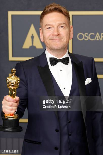 Kenneth Branagh, winner of the Oscar for Original Screenplay for Belfast, poses in the press room during the 94th Annual Academy Awards at Hollywood...