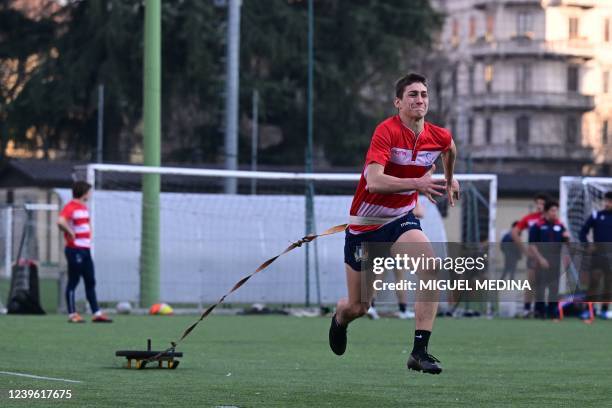 Under-19 rugby players train on March 22, 2022 at the Istituto Leone XIII, a private school located on the edge of Milan's City Life district, and...