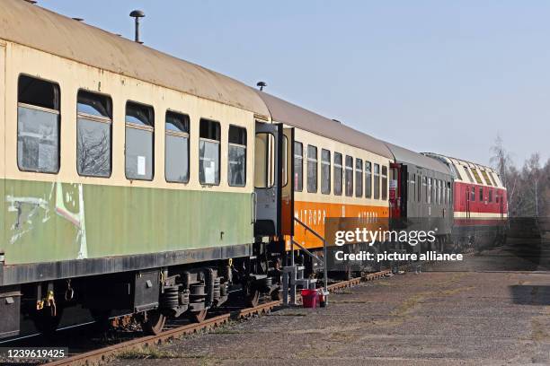 March 2022, Saxony-Anhalt, Staßfurt: Historic vehicles of the former German Reichsbahn are on the premises of the Eisenbahnfreunde...