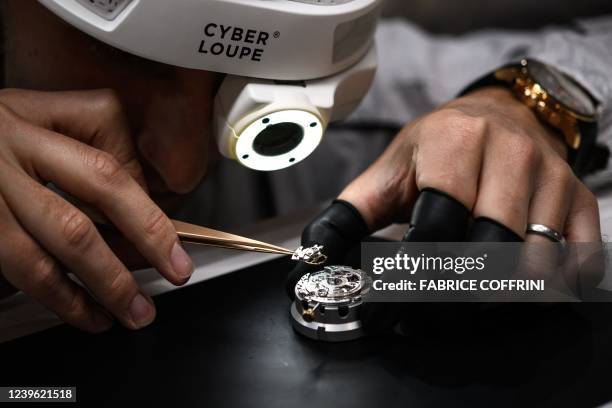 Watchmaker shows the "cyberloupe" a digitalized magnifying glass that can livestreaming, created by luxury Swiss watch manufacturer IWC, on the...