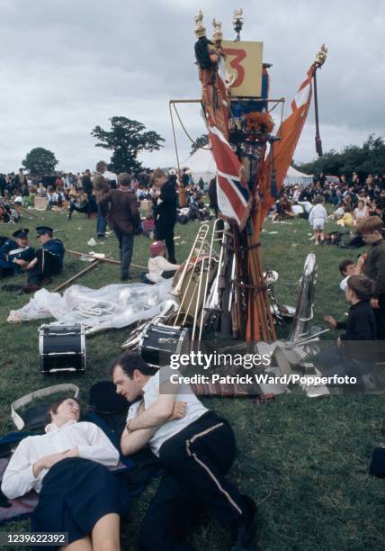 Participants relaxing following a reenactment of the Battle of the Boyne, complete with band, on the Glorious 12th or Orangemen's Day in Belfast,...