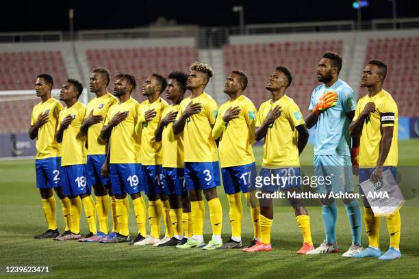 Players of Solomon Islands sing the national anthem during the 2022 FIFA World Cup Oceania Qualifier Final match between Solomon Islands and New...