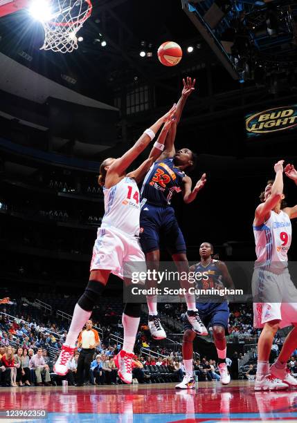 Kalana Greene of the Connecticut Sun puts up a shot against Erika deSouza of the Atlanta Dream at Philips Arena on September 6, 2011 in Atlanta,...