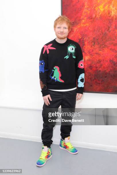 Ed Sheeran attends a private view of artist Jelly Green's new exhibition "Burn" at Noho Studios on March 30, 2022 in London, England.