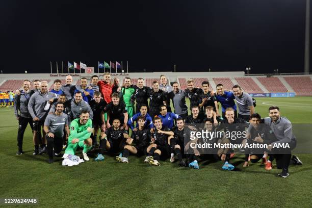 Players and staff of New Zealand pose for a photo at full time after qualifying for the World Cup during the 2022 FIFA World Cup Oceania Qualifier...