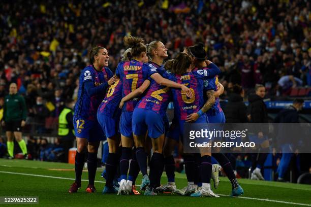 Barcelona's players celebrate after scoring a goal during the women's UEFA Champions League quarter final second leg football match between FC...