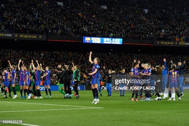 Barcelona's players celebrate at the end of the women's UEFA Champions League quarter final second leg football match between FC Barcelona and Real...