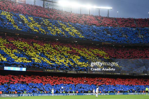 Barcelona's supporters cheers his team during the women's UEFA Champions League quarter final second leg football match between FC Barcelona and Real...