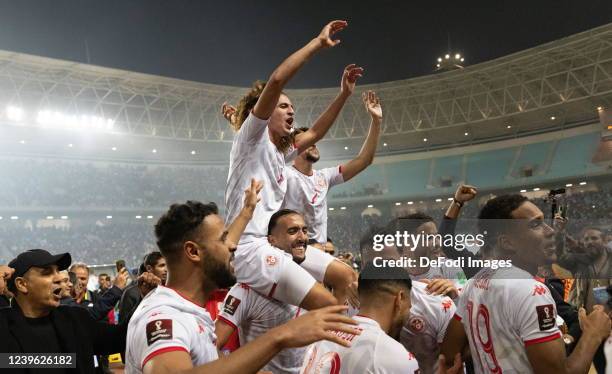 Players of Tunisia celebrate after beating the team Mali at the end of the second leg of the FIFA World Cup African Qualifiers 3rd round match...