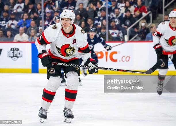 Nick Holden of the Ottawa Senators keeps an eye on the play during first period action against the Winnipeg Jets at Canada Life Centre on March 24,...