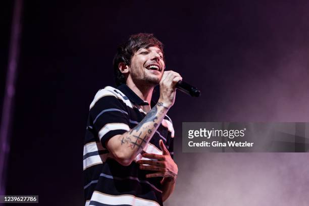 Singer Louis Tomlinson performs live on stage during a concert at Mercedes Benz Arena on March 30, 2022 in Berlin, Germany.