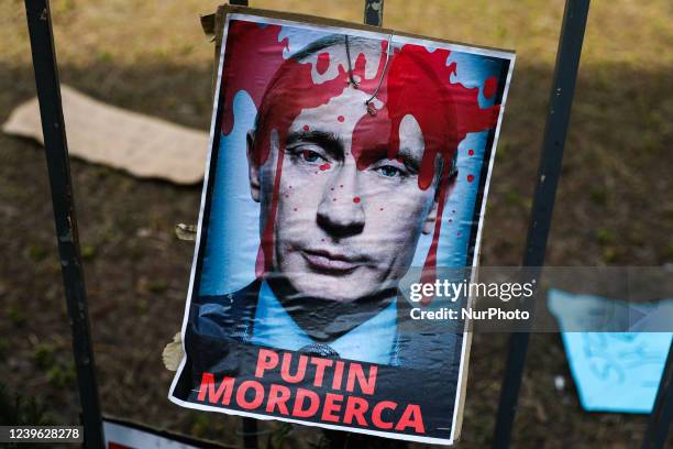 Banner reading 'Putin murderer' is seen at the square in front of the Consulate General of Russia which was unofficially named the Square of Free...