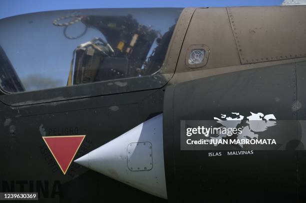 The Malvinas island silhouette is seen painted next to the cockpit of adisaffected IAI Dagger of Argentina's Air Forces during a meeting of veterans...