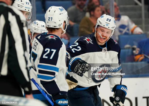 Mason Appleton of the Winnipeg Jets celebrates with teammates after scoring a goal against the Buffalo Sabres during the second period at KeyBank...