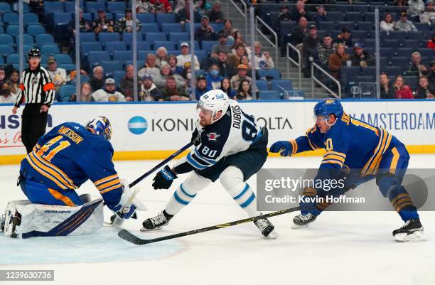 Craig Anderson of the Buffalo Sabres makes the save against Pierre-Luc Dubois of the Winnipeg Jets as Henri Jokiharju defends during the second...