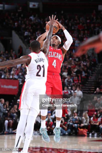 Devonte' Graham of the New Orleans Pelicans shoots a three point basket during the game against the Portland Trail Blazers on March 30, 2022 at the...
