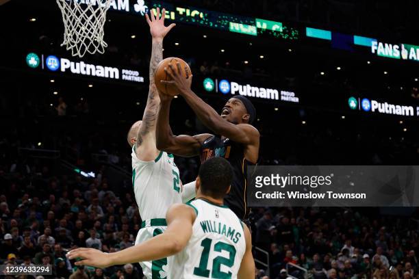 Jimmy Butler of the Miami Heat goes to the basket against the Boston Celtics during the second quarter at TD Garden on March 30, 2022 in Boston,...