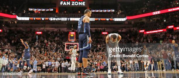 Dejounte Murray of the San Antonio Spurs hangs his head as teammate's Keldon Johnson of the last-second shot did not go in as Dillon Brooks of the...