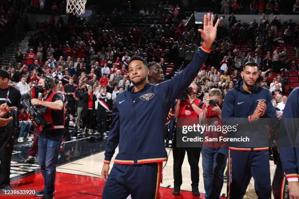McCollum of the New Orleans Pelicans embraces the fans before the game against the Portland Trail Blazers on March 30, 2022 at the Moda Center Arena...