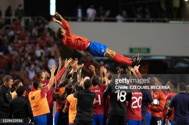 Costa Rica players celebrate their victory against the USA during their FIFA World Cup Qatar 2022 Concacaf qualifier match at the National Stadium in...