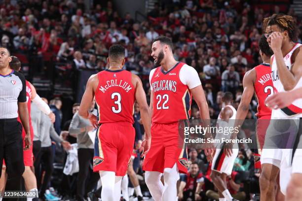 McCollum and Larry Nance Jr. #22 of the New Orleans Pelicans embrace during the game against the Portland Trail Blazers on March 30, 2022 at the Moda...
