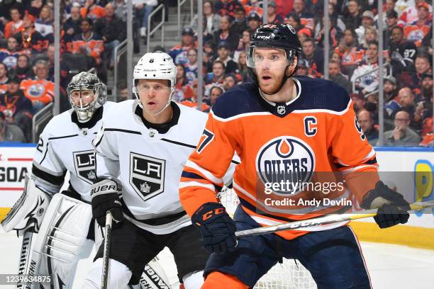 Connor McDavid of the Edmonton Oilers battles for position against Olli Maatta of the Los Angeles Kings on March 30, 2022 at Rogers Place in...