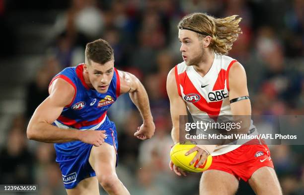 James Rowbottom of the Swans and Josh Dunkley of the Bulldogs in action during the 2022 AFL Round 03 match between the Western Bulldogs and the...