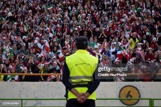 An Iranian policeman monitors an area as soccer female fans attend the Azadi stadium in western Tehran, October 10, 2019. Despite the Iranian sports...