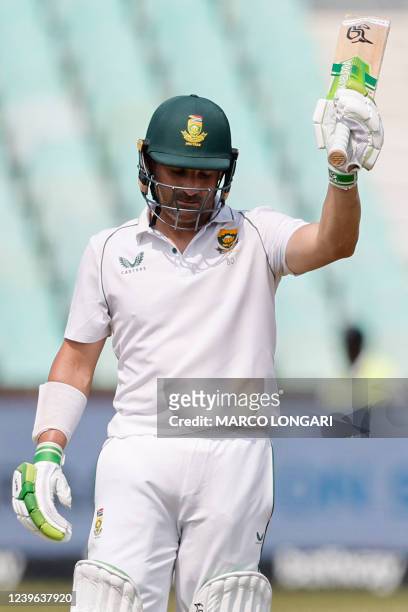 South Africa's Dean Elgar celebrates after scoring a half-century during the first day of the first Test cricket match between South Africa and...