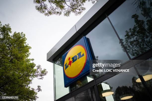 This picture taken in Nantes, on March 31 shows a logo at the entrance of a Lidl discount supermarket.