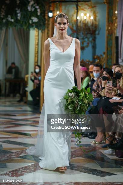 Model showcases Lorena Merino design during the Atelier Couture bridal catwalk within Madrid Fashion Week, held at the Santonia Palace in Madrid.