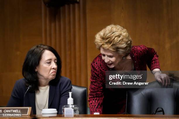 Sen. Maria Cantwell speaks with Sen. Debbie Stabenow during a Senate Finance Committee hearing on Capitol Hill March 31, 2022 in Washington, DC. Tai...