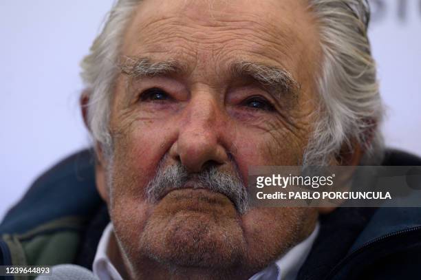 Uruguayan former President Jose Mujica speaks with journalists after taking part in the launching of the book "Uruguay, la revolución de los derechos...