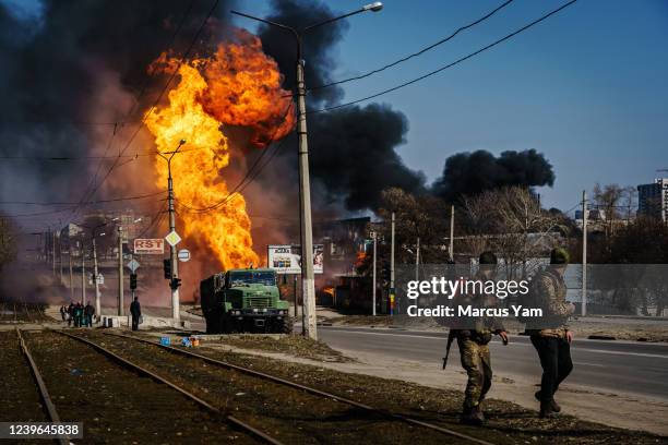 Ukrainian soldiers hitched and moved an artillery unit after Russian bombardment destroyed a building near their position, in the Moskovskyi district...