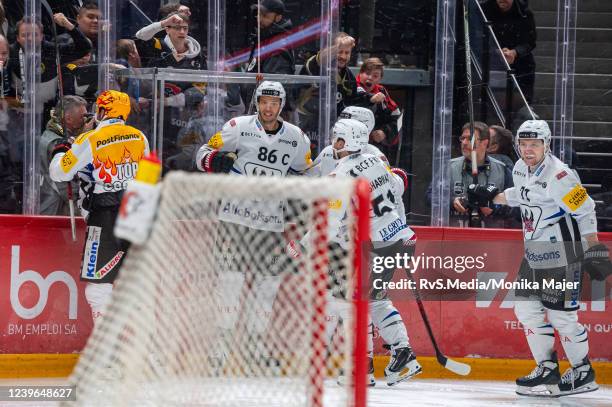 Julien Sprunger of HC Fribourg-Gotteron celebrates his goal with teammates during the National League Play Off Quarter final - Game 4 match between...