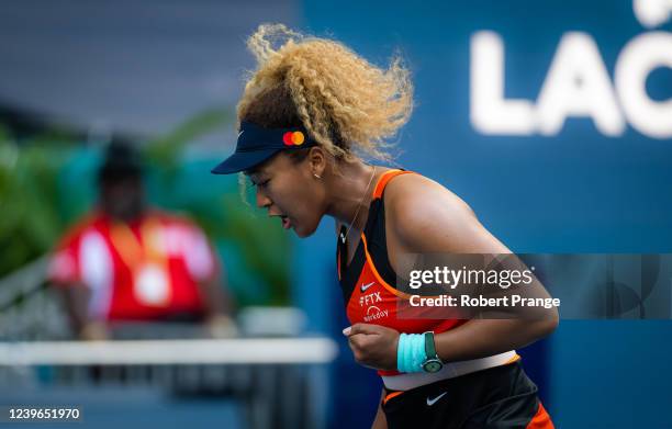 Naomi Osaka of Japan celebrates winning a point against Belinda Bencic of Switzerland in her semi-final match on day 11 of the Miami Open at Hard...