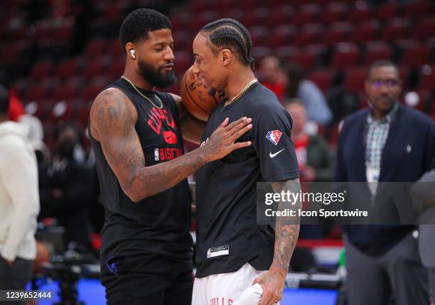 Los Angeles Clippers guard Paul George and Chicago Bulls forward DeMar DeRozan chat before a NBA game between the Los Angeles Clippers and the...