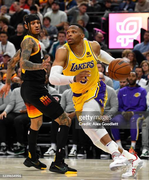 Russell Westbrook of the Los Angeles Lakers drives past Jordan Clarkson of the Utah Jazz during the first half at Vivint Smart Home Arena on March...